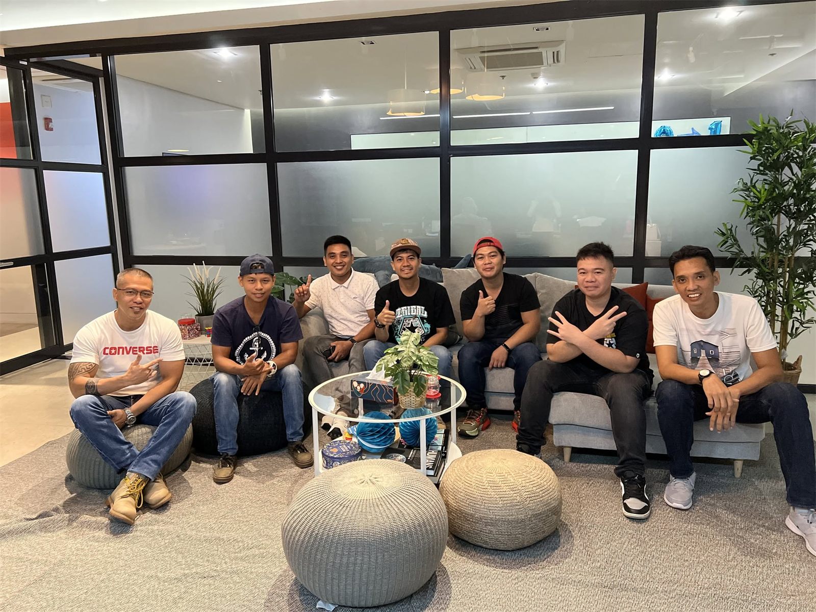 A relaxed group of LT Marine crew gathered in the office lounge, talking and smiling together between briefings.